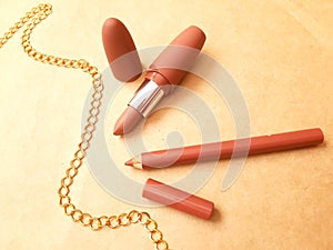 lipsticks and golden chain photo