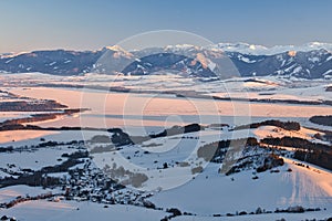 Liptov countryside and frozen Liptovska Mara dam from Janosikov stol rock during winter