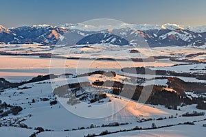 Liptov countryside and frozen Liptovska Mara dam from Janosikov stol rock during winter