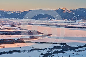 Liptov countryside and frozen Liptovska Mara dam from Janosikov stol rock during winter