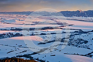 Liptov countryside and frozen Liptovska Mara dam from Janosikov stol rock during winter