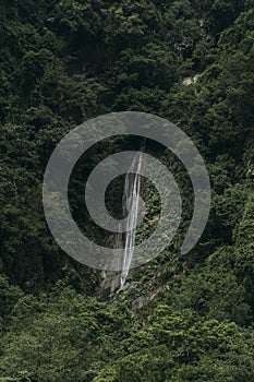 Liqin waterfall in lush forest in Hualien, Taiwan