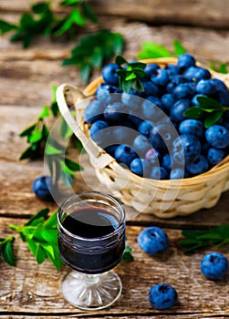 Liqueur from blueberry in a shot glass