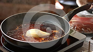 Liquid boils on frying pan.