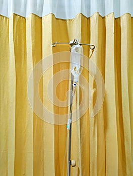 liquid in a bottle hanging on a gallows