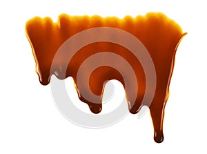 Liquid caramel on white background