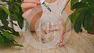 Liquid chlorophyll in a glass of water. Selective focus.