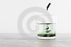 Liquid Chlorophyll in a Glass of Water, Superfood, Healthy Eating, Detox Concept