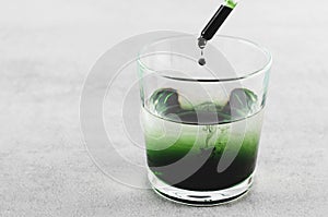 Liquid Chlorophyll in a Glass of Water, Superfood, Healthy Eating, Detox Concept