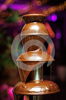 Liquid chocolate fountain at an event or celebration