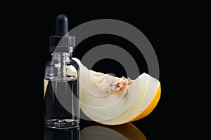 Liquid concentrate for filling an electronic cigarette in a container stands next to a slice of ripe melon on a black background