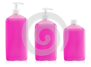 The Liquid container for gel, lotion, cream, shampoo, bath from pink cosmetic plastic bottle with white dispenser pump