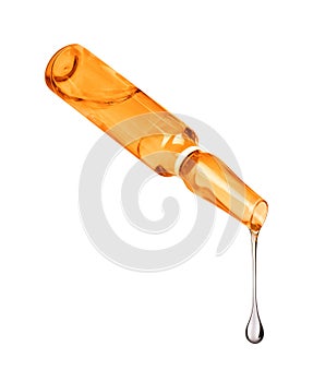 Liquid drips from ampoule isolated on white background