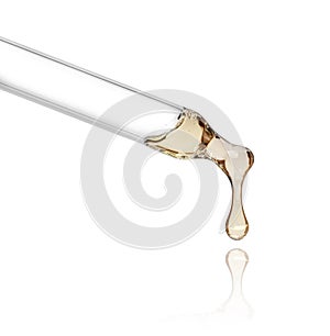 Liquid drop from cosmetic pipette close up