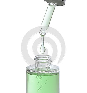Liquid drop from cosmetic pipette close up