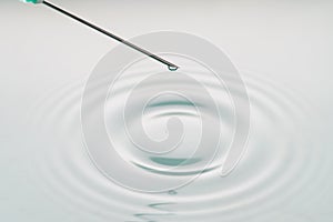 Liquid drop on the tip of syringe