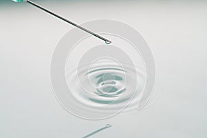 Liquid drop on the tip of syringe