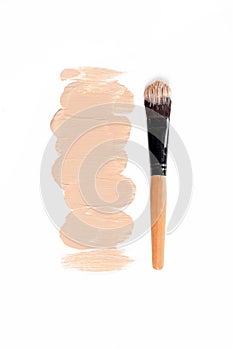 Liquid foundation and brush on white