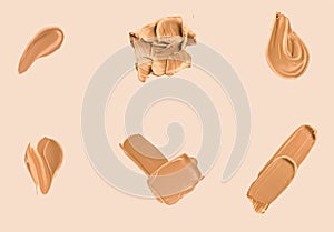 Liquid foundation smudges, smears and strokes as makeup textures isolated on beige background, beauty and cosmetics