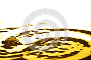 Liquid gold drop and ripple