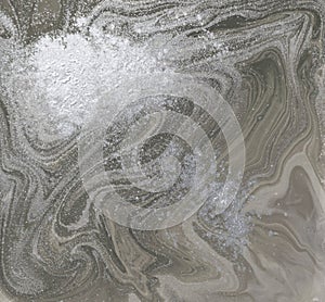 Liquid gold marbled pattern. Pale beige background