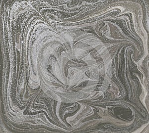 Liquid gold marbled pattern. Pale beige background