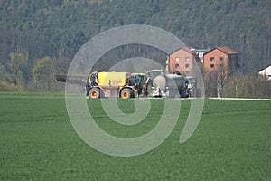 A liquid manure AKA slurry spreader being refilled