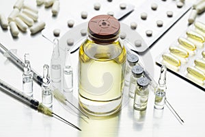 Liquid medicine, ampoules, syringes with needles