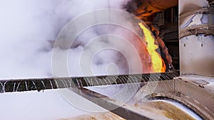 Liquid metal from flowing from blast furnace. Stock footage. Industrial background, melted metal or hot steel on the