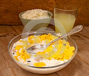 Liquid milk whey in a glass and cottage cheese in bowl on rustic wooden background. Dairy production Breakfast