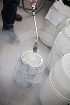 Liquid nitrogen technician fills container