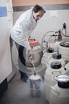 Liquid nitrogen technician fills container