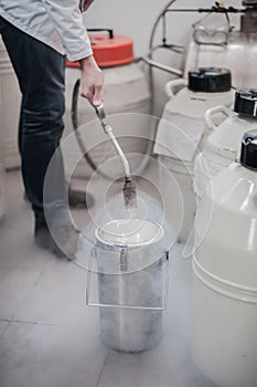 Liquid nitrogen technician fills container