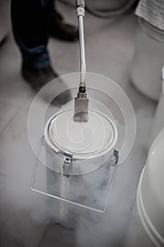 Liquid nitrogen technician fills container