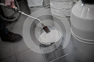 Liquid nitrogen technician fills container