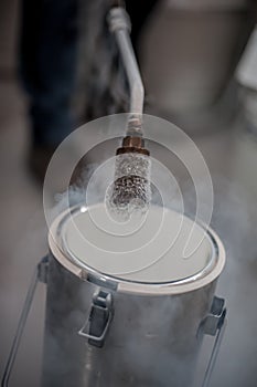 Liquid nitrogen technician fills container