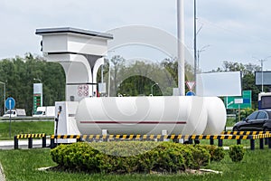 Liquid propane gas station. Black modern SUV car refueling tank with alternative power natural liquefied fuel