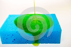 liquid soap falling on a sponge