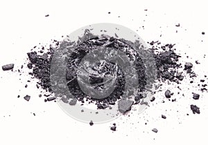 Liquid and solid black natural cosmetic activated charcoal or volcanic clay with scrub effect on white background