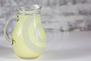 Liquid whey that remains after formation of curds in jar on white background
