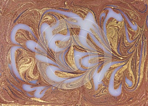 Liquid white and gold marbled pattern. Beige background