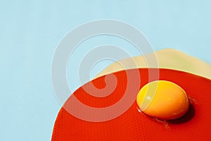 The liquid yolk lies on the red circle. The texture of a red circle with small polka dots of the same color.