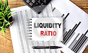 LIQUIDITY RATIO text on a notebook with chart and calculator