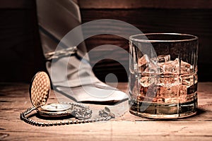 Liquor, neck tie, and a pocket watch.