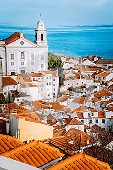 Lisbon, Alfama district with orange roof tiles and white walls, Portugal