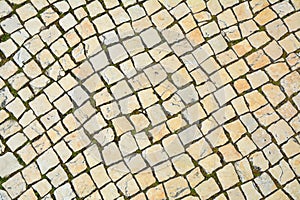 Lisbon pavement made of limestone squares background