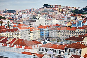 Lisbon Portugal - Beautiful panoramic view of the red roofs of houses in antique historical district Alfama and the Tagus River