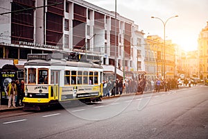 LISBON, PORTUGAL - December 31, 2017: Street view with famous old historic tourist yellow tram. Famous vintage tourist