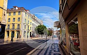 Lisbon Portugal. Empty wide street with storefront