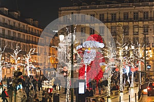 Lisbon, Portugal - 12/26/18: Giant Santa statue in the middle of the street in Baixa Chiado